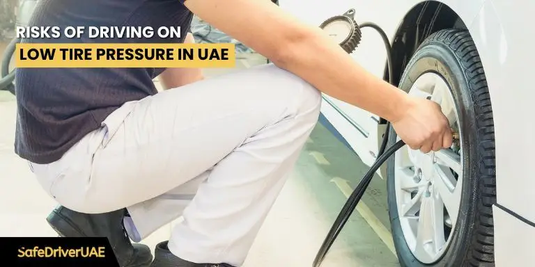 A car driving on a road, highlighting the dangers of low tire pressure in hot UAE conditions.
